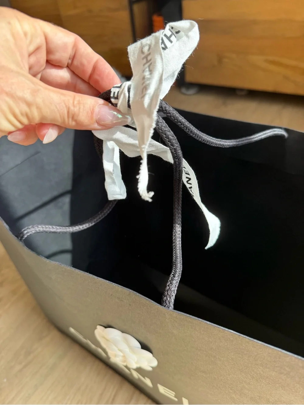 Authentic CHANEL Black and White shopping bag with Camellia Accents
